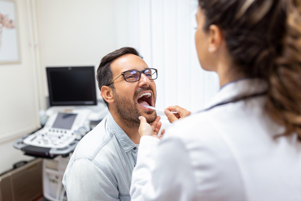 doctor-using-inspection-spatula-examine-patient-throat-ent-doctor-doing-throat-exam-patient-opened-his-mouth-throat-checkup